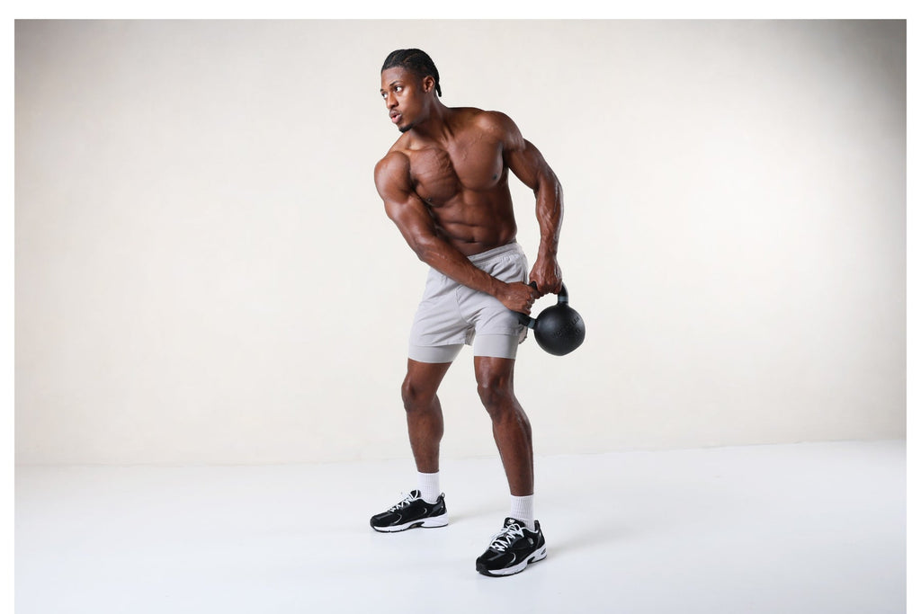 Man exercising with a single heavy kettlebell