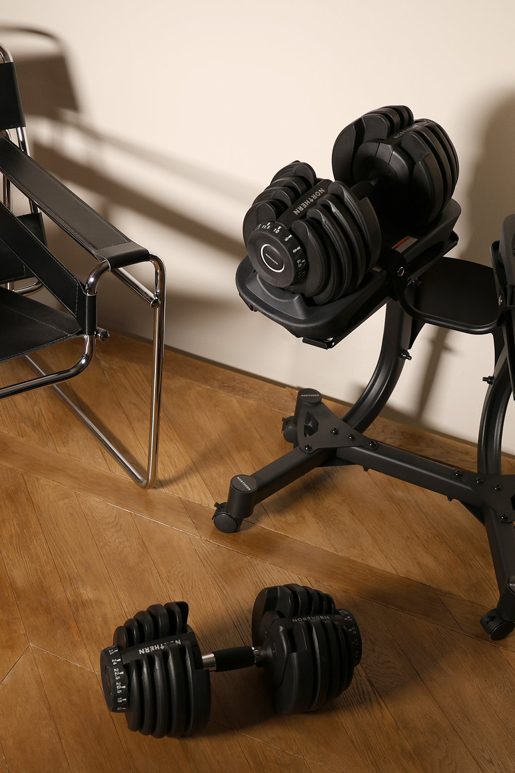 A closer look of a lifetsyle image of Northern Stealth Adjustable Dumbbell Set 24kg with Stealth Rack