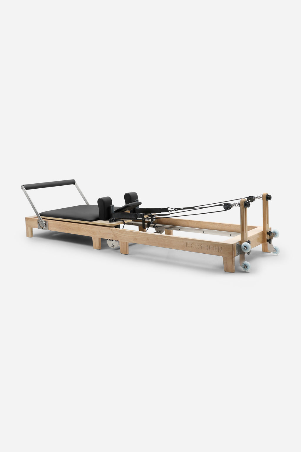 Northern Folding Reformer Bed Black full-length Pilates reformer with rubberwood frame adjustable footbar and resistance system