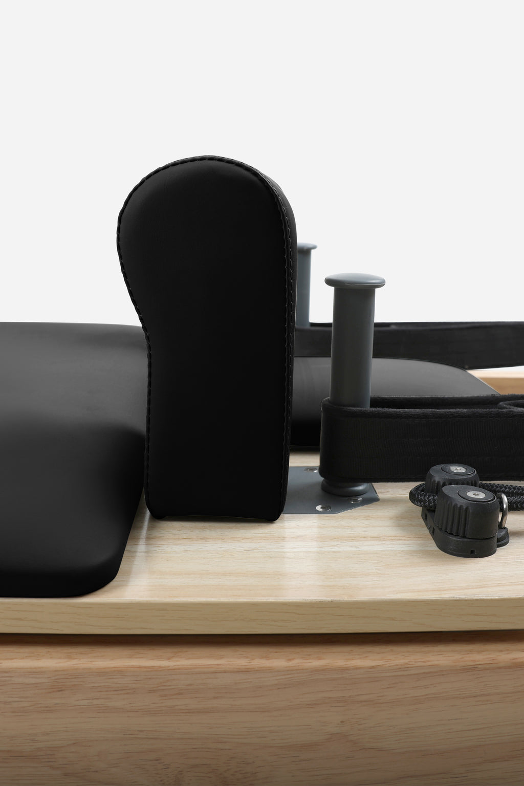 Northern Folding Reformer Bed Black padded shoulder block and adjustable rope components close-up