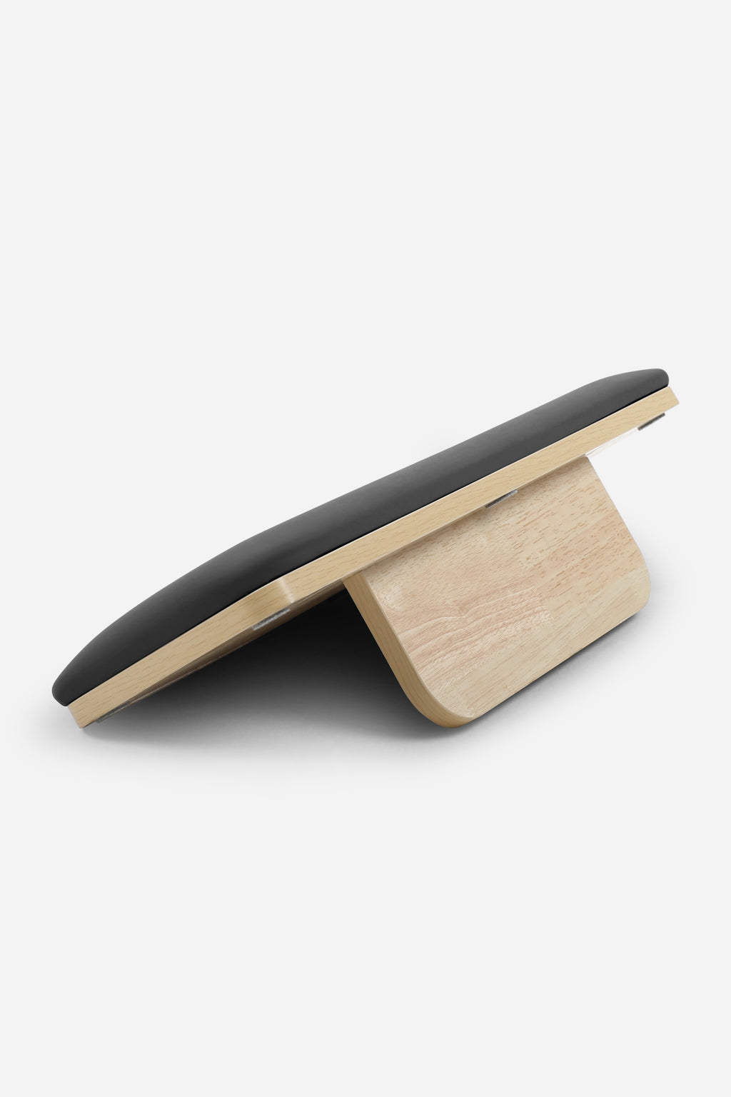 Northern Folding Reformer Bed jump board shown raised on wooden support