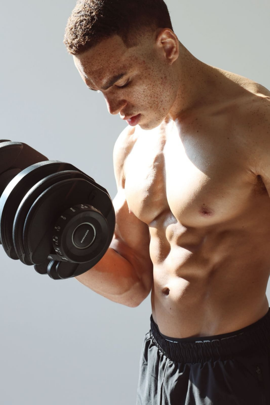 Man doing bicep curl using Northern Adjustable Dumbbell