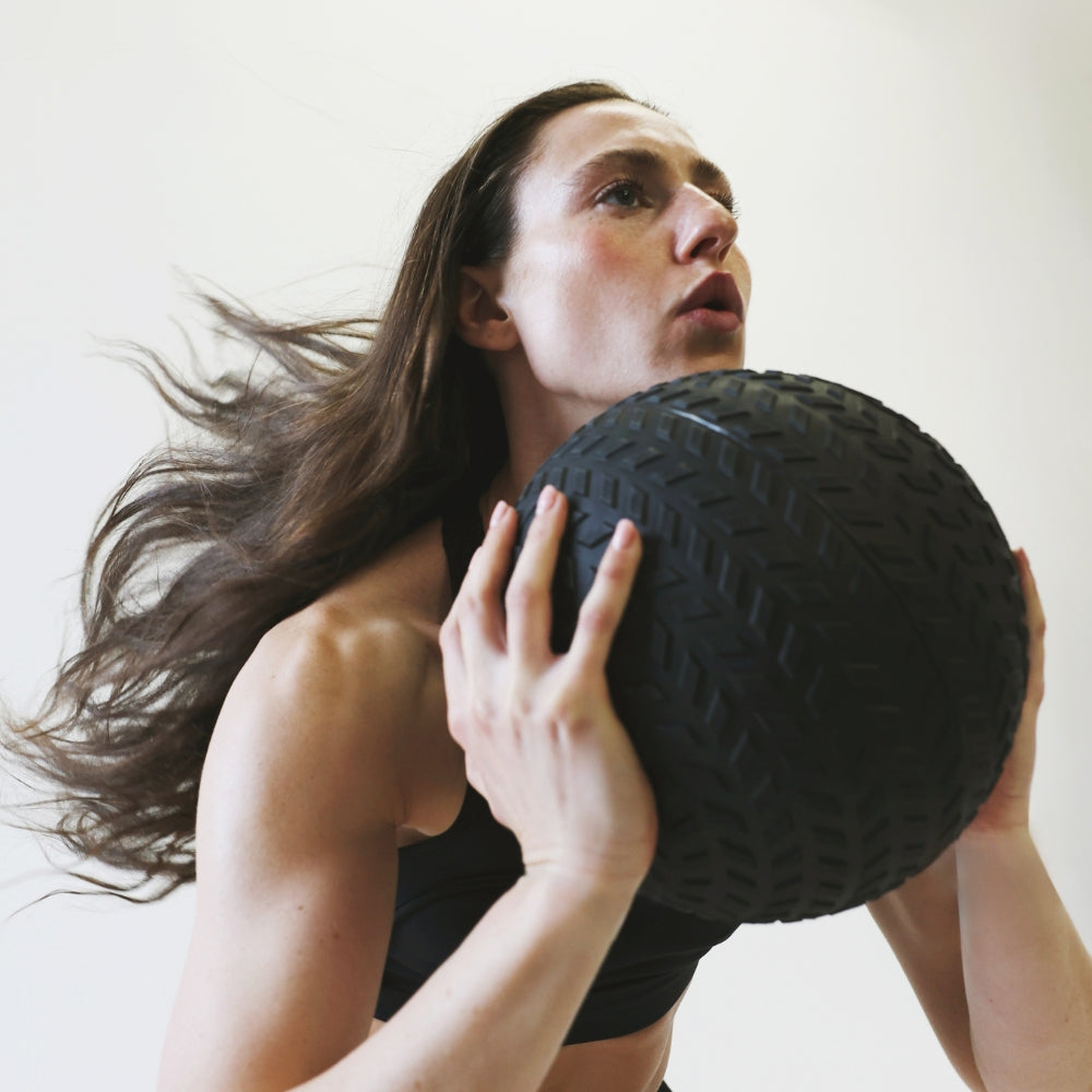 Blue Light Discount - Woman Athlete Performing Fitness Ball Workout