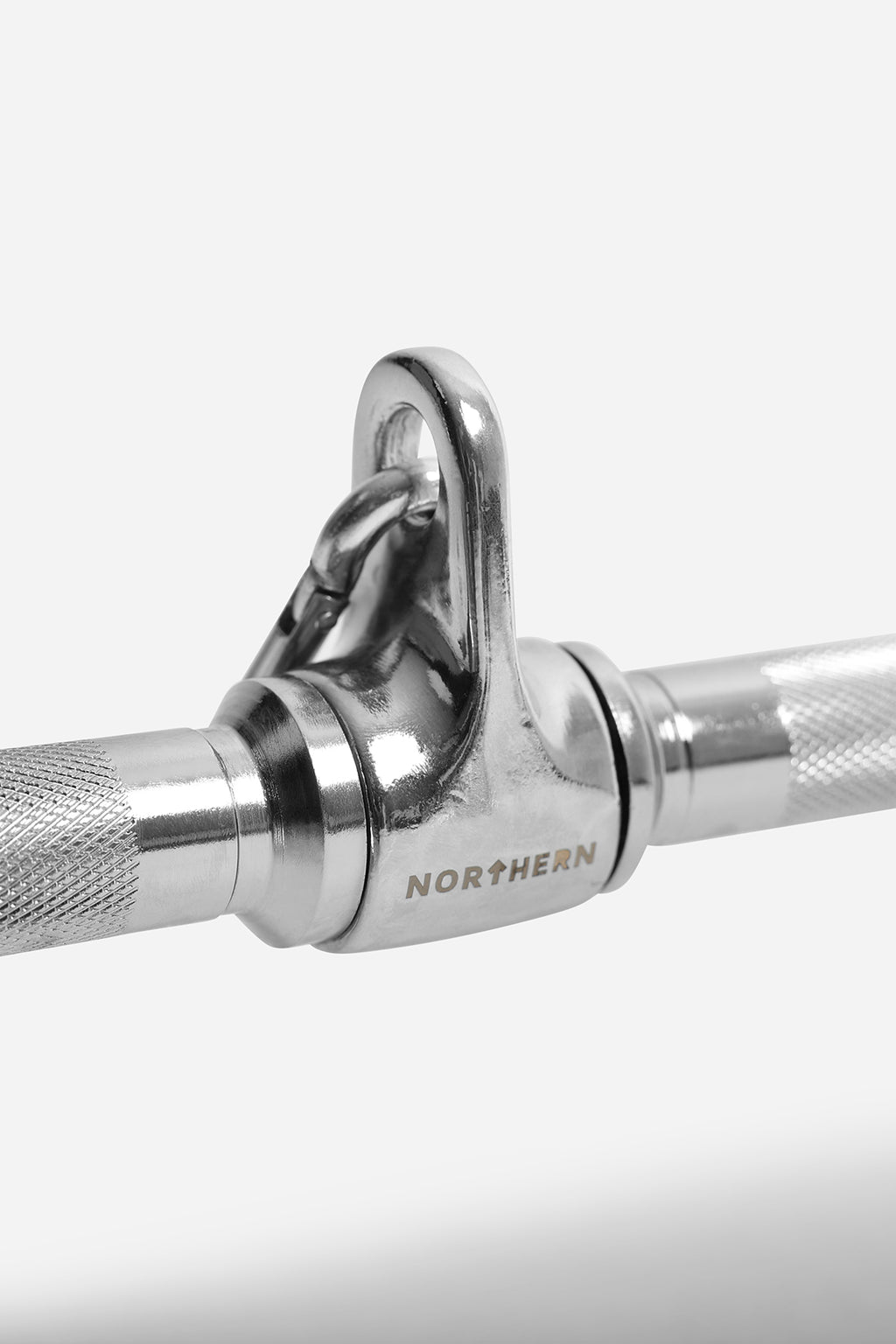 Detailed view of rotating swivel joint and quick-clip attachment on lat pulldown bar