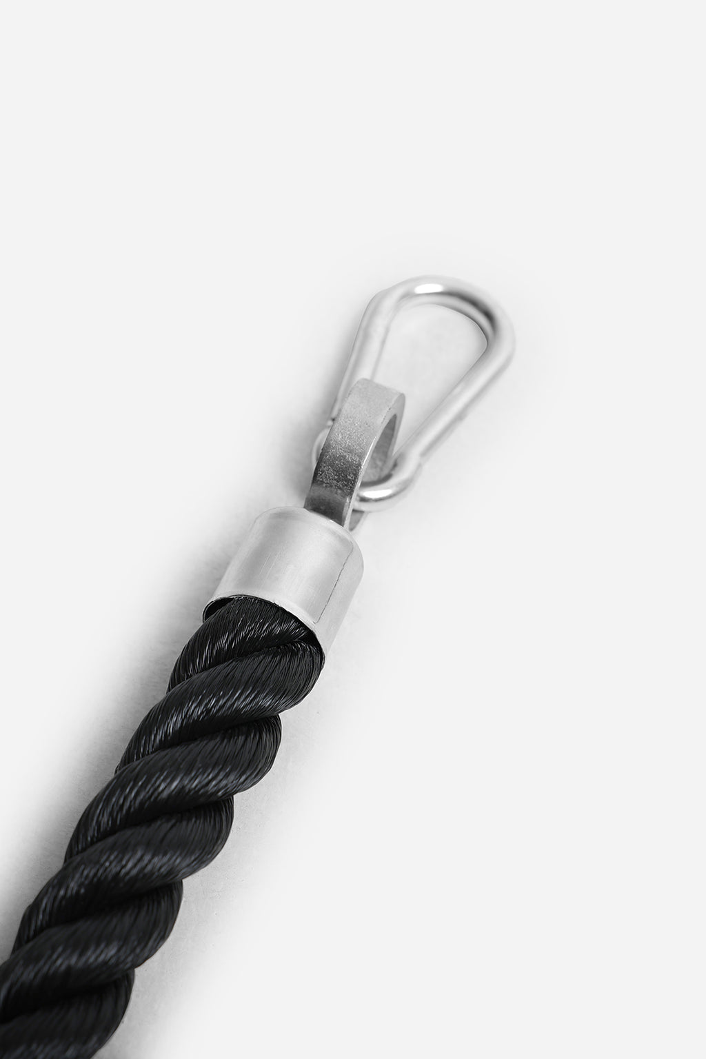 Close-up of single grip tricep rope attachment featuring chrome connection cap and cable clip