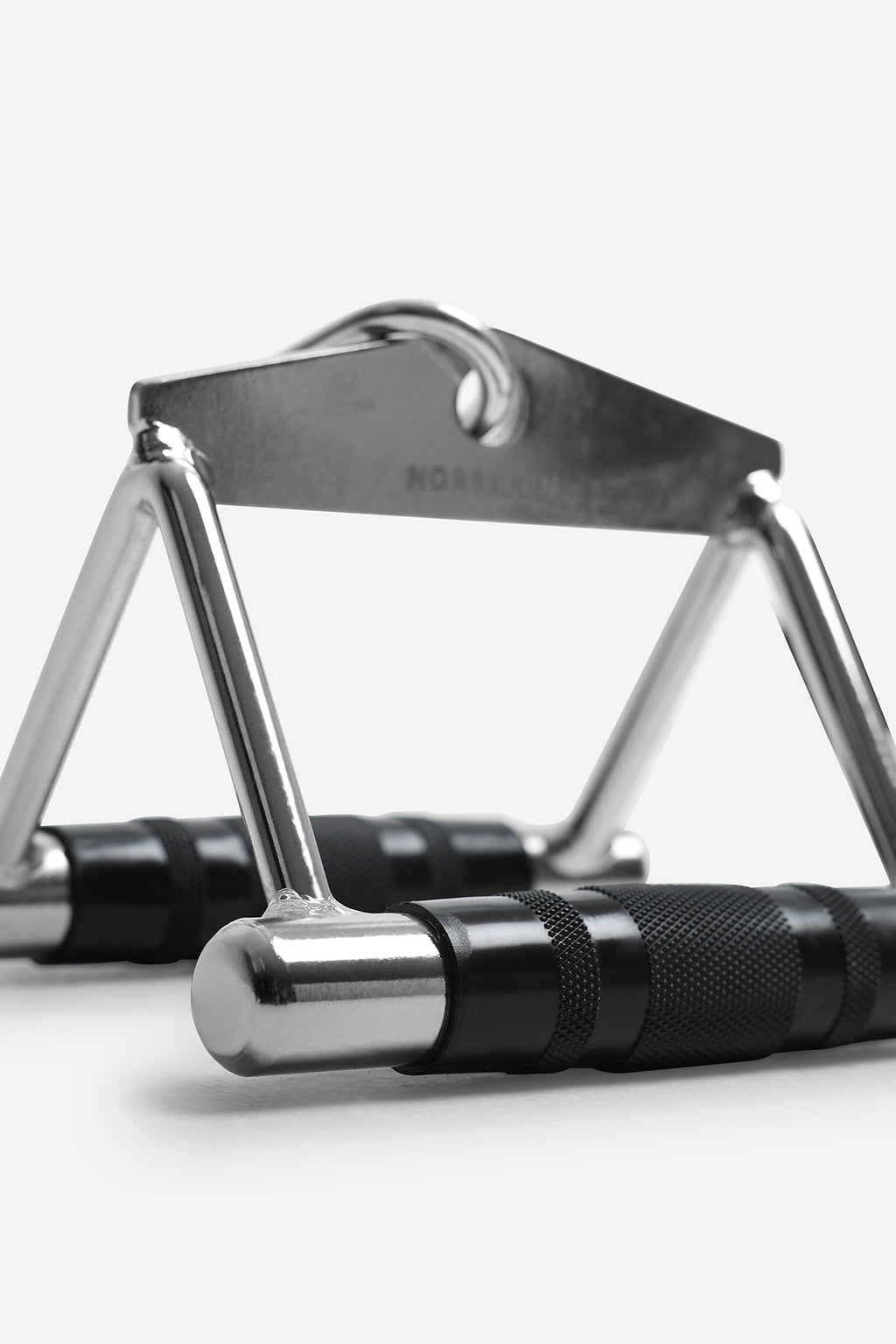 Close-up of close grip cable row handle featuring textured knurled grips and heavy-duty steel frame