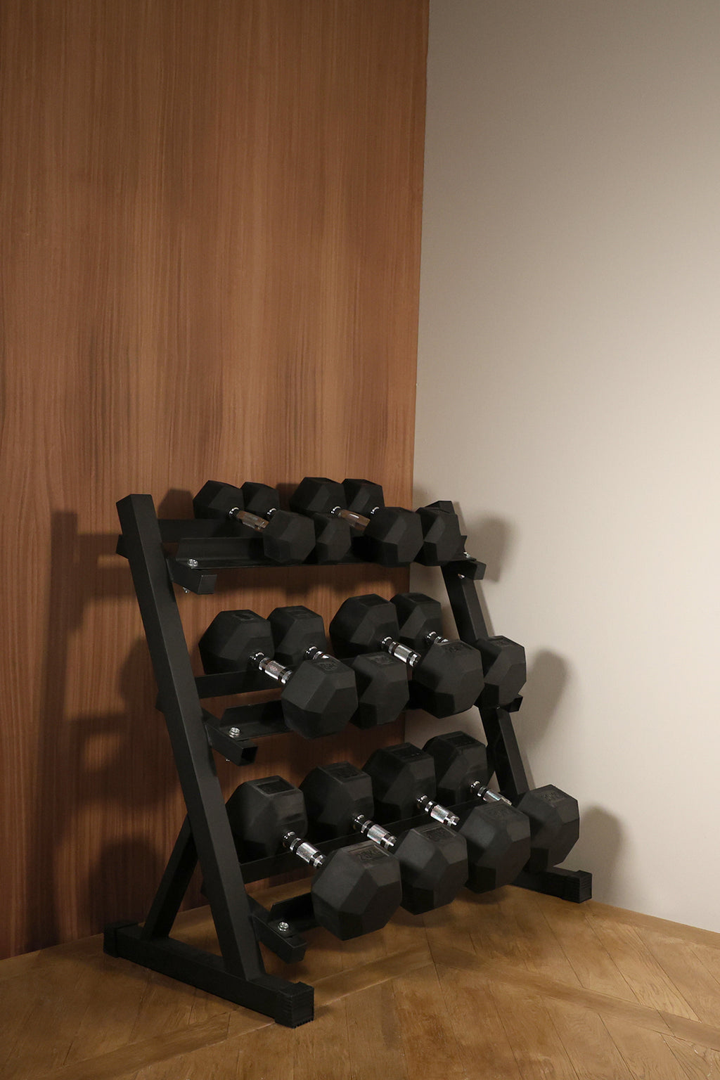 Lifestyle image of Northern Hex Dumbbell Set 5-30kg with 3-Tier Rack