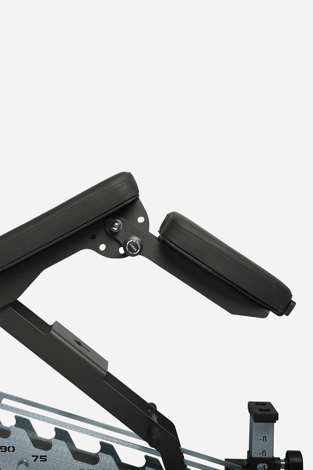 Close-up of bench backrest adjustment showing folded pad and support bracket