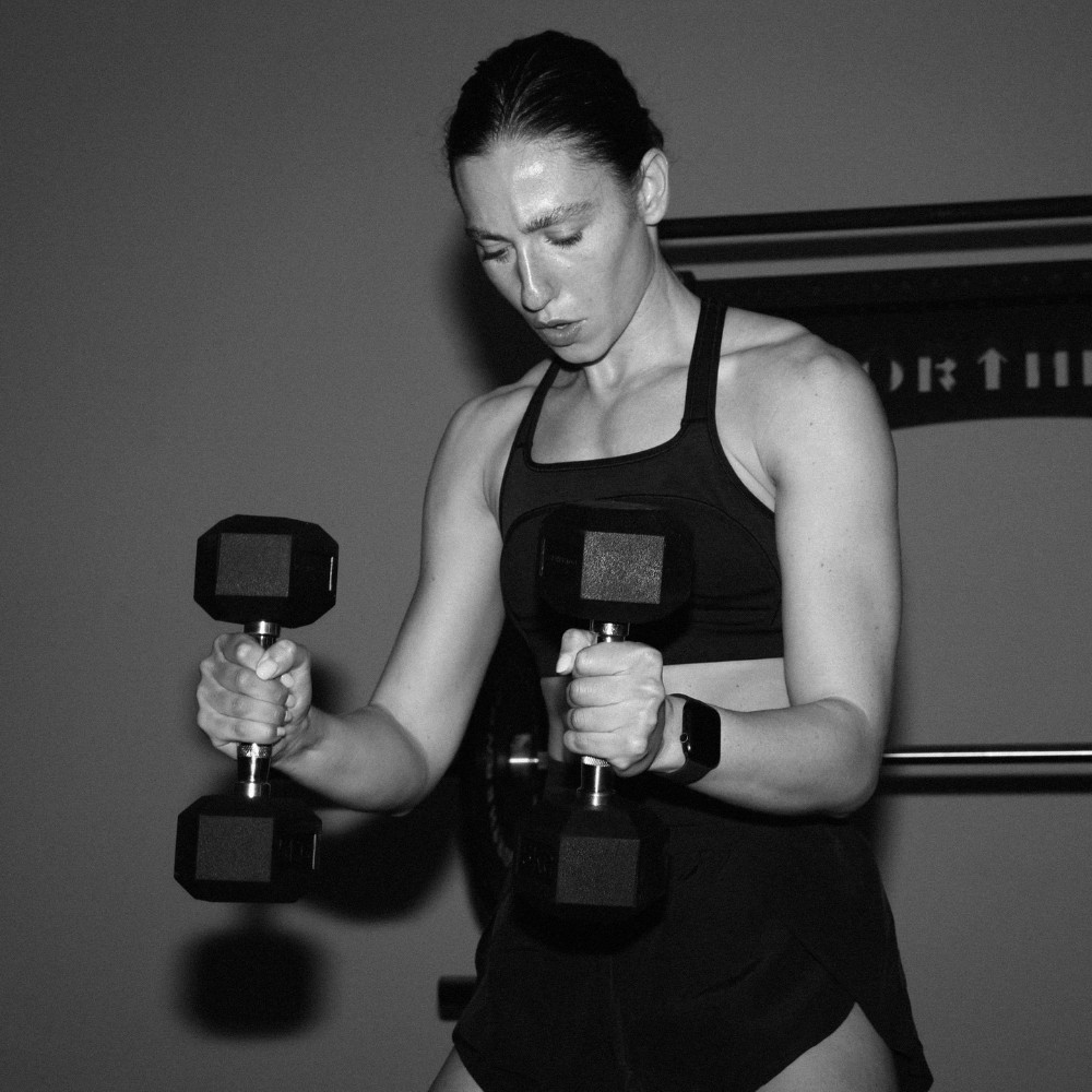 Athlete Performing Dumbbell Workout and Firmly Gripping Rubber Coated Hex Dumbbell