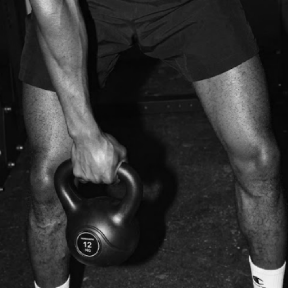 Close-up of an athlete gripping Northern Vinyl kettlebell during kettlebell swing workout