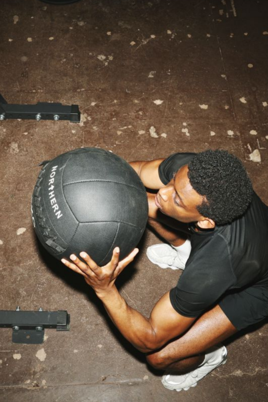 Man Performing Squat Workout Using Northern Exercise Ball