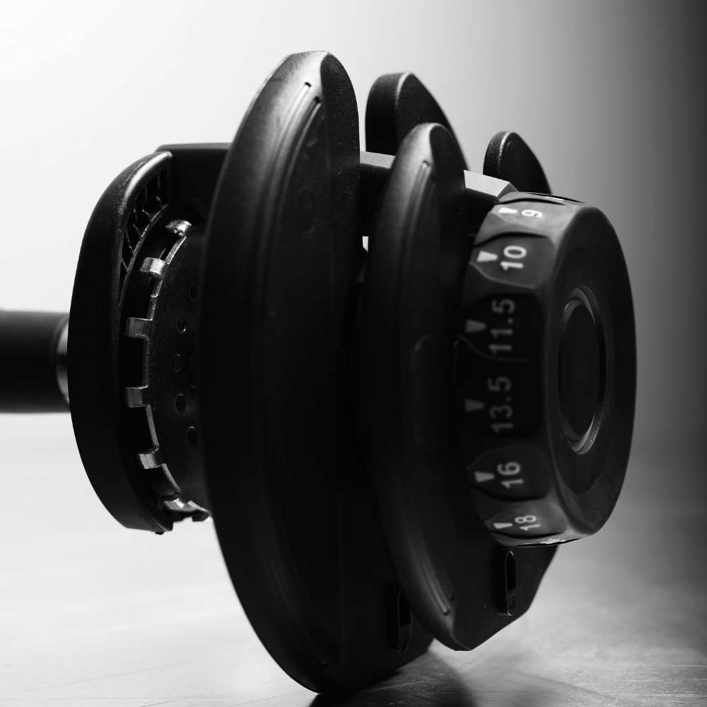 Northern Adjustable Dumbbell Weight on the floor and close up with its unique Quick Dial System