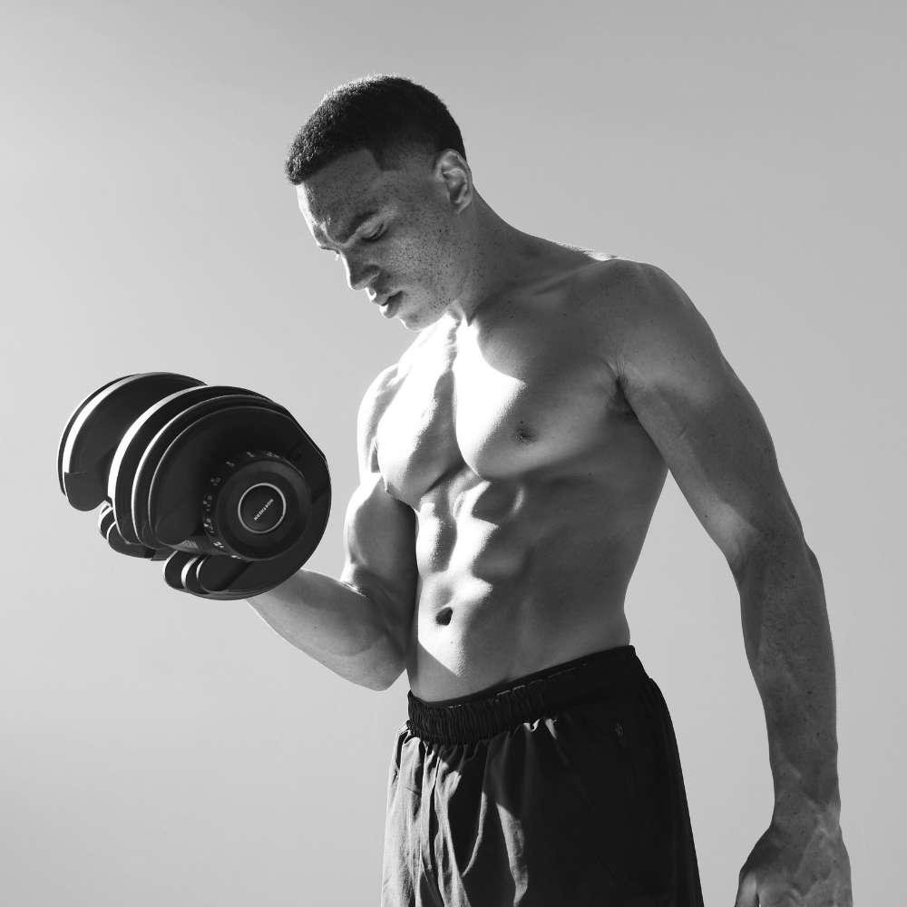 Athlete performing bicep curl using Northern Adjustable Dumbbell in home gym