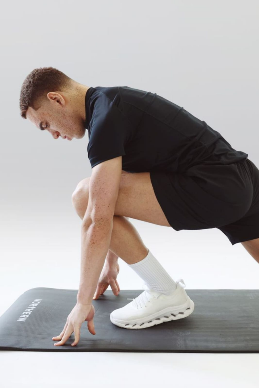 Man stretching using soft foam yoga mats