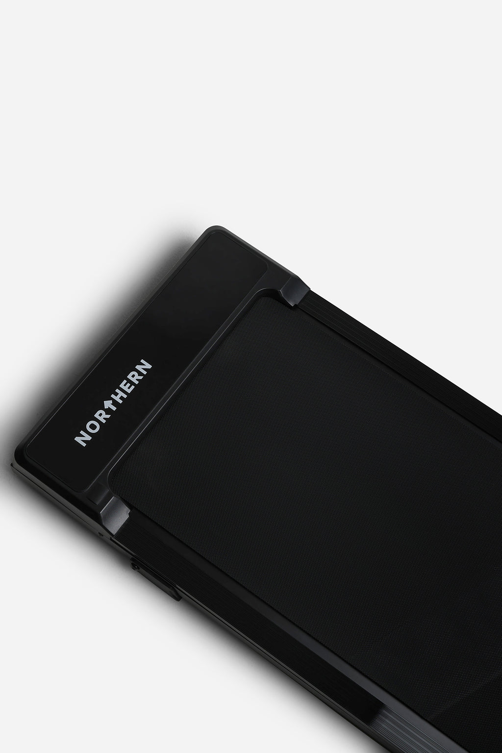Northern Folding Walking Pad angled top view showing Northern branding and textured walking belt