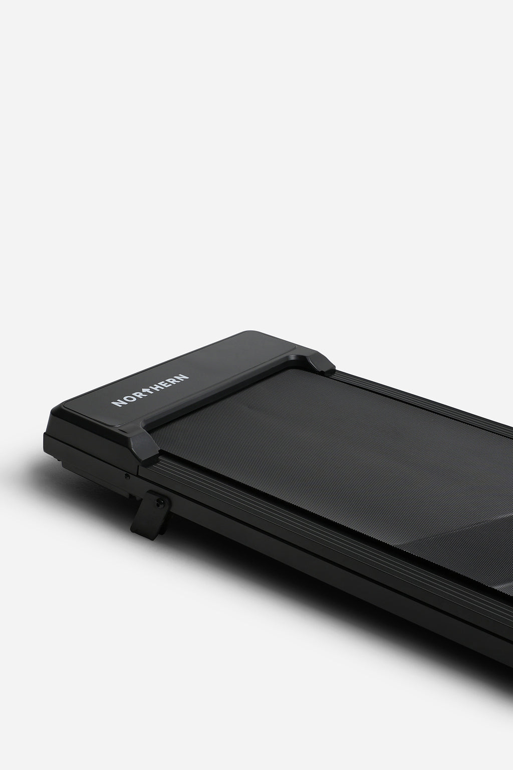Northern Folding Walking Pad angled close-up showing textured belt, frame and manual incline support
