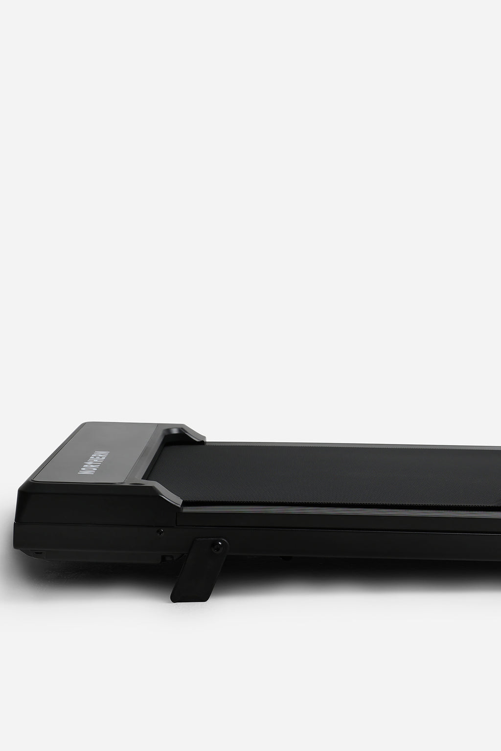Northern Folding Walking Pad side close-up showing manual incline support and slim frame