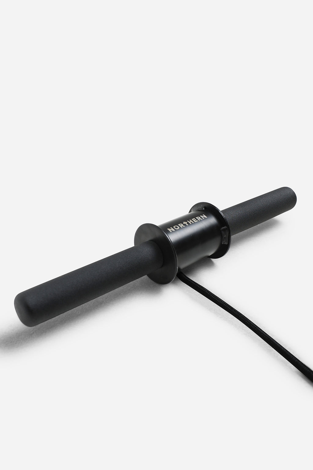 Northern wrist roller showing rubber-coated grip, centre spool and braided rope