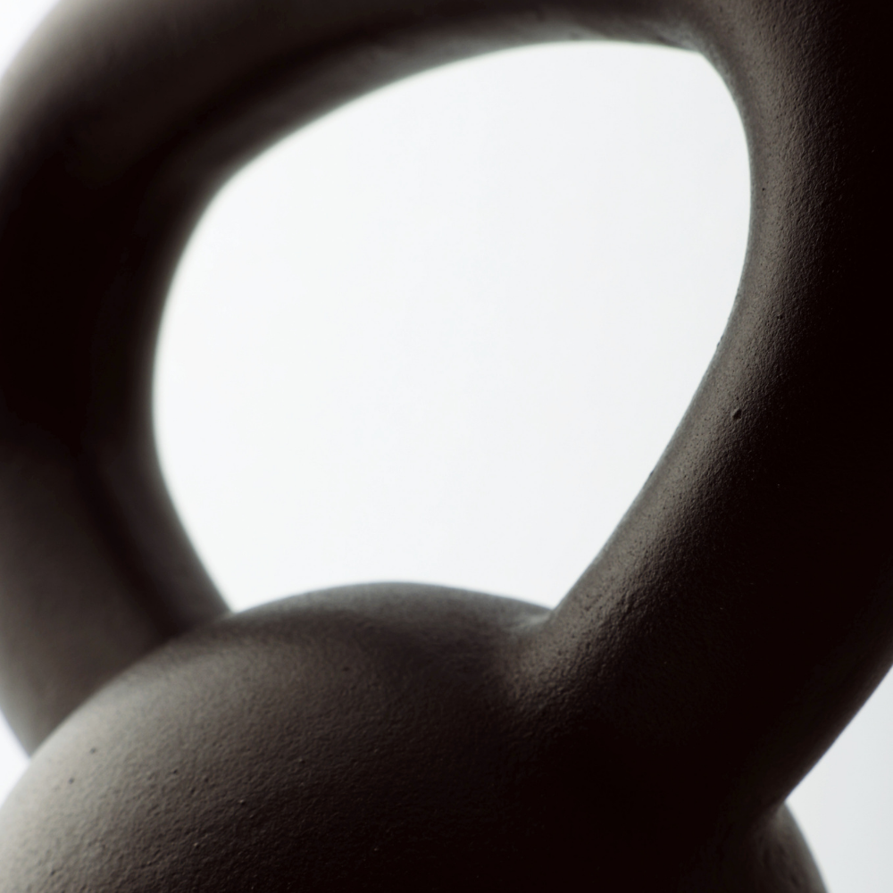 Closeup view of wide handle grip of cast iron kettlebell weights